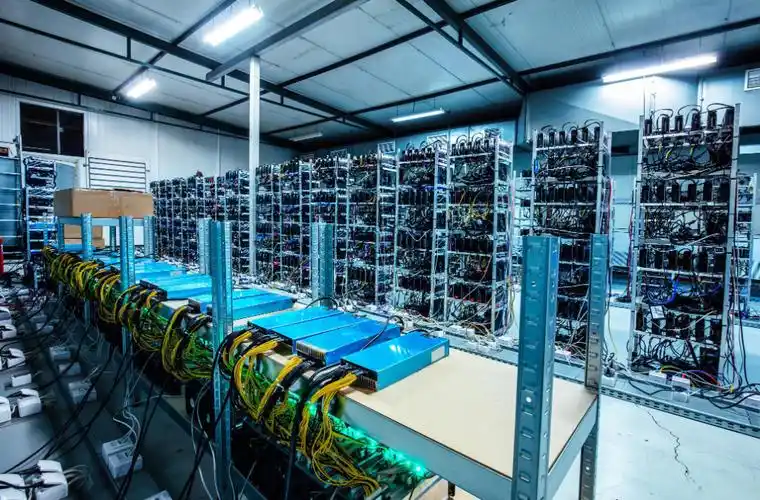 A large-scale mining farm with rows of mining rigs, illustrating the industrial scale and infrastructure required for efficient cryptocurrency mining.